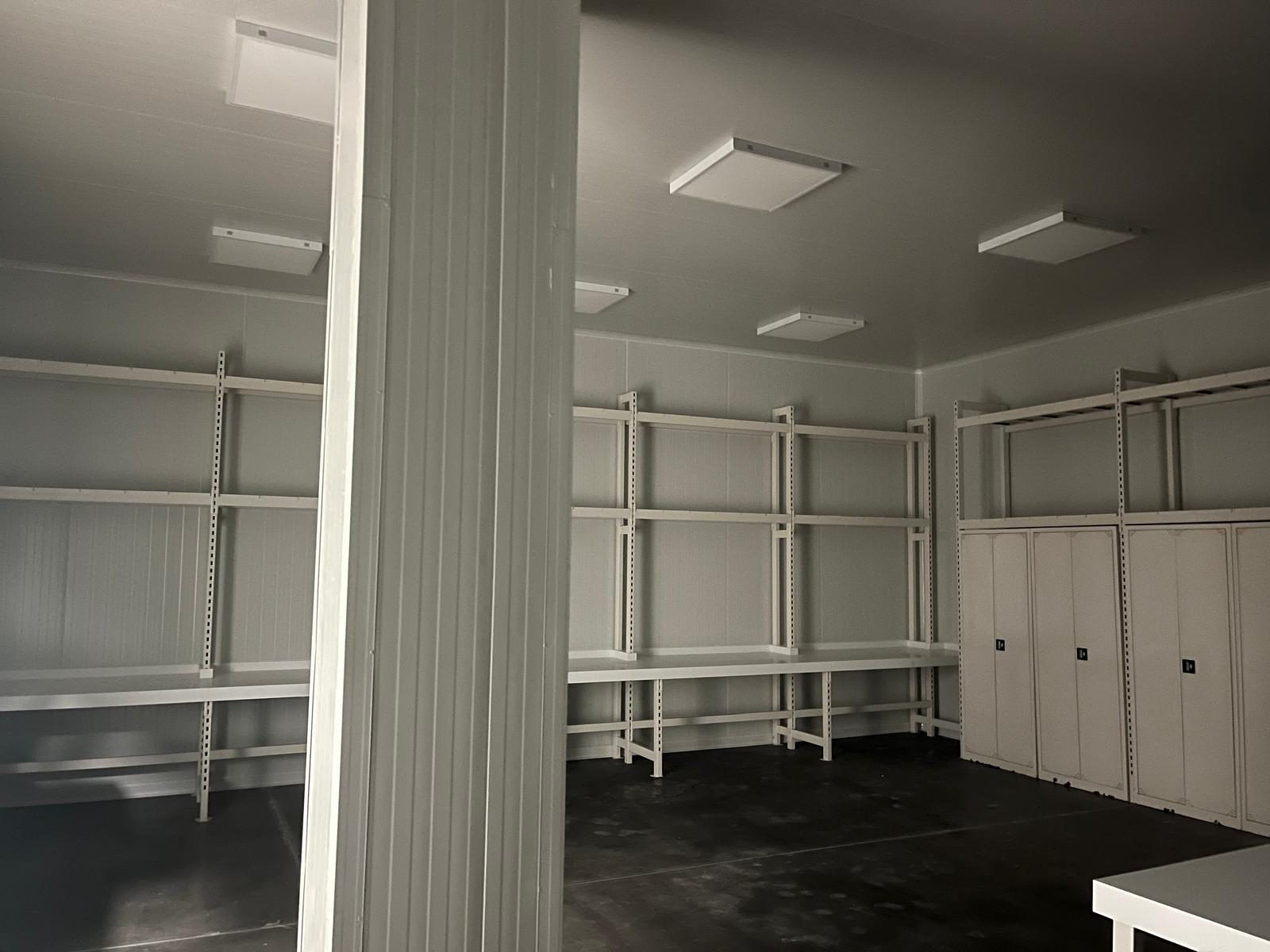 A panel-lined room with shelving. The shelving is not a catalog product.