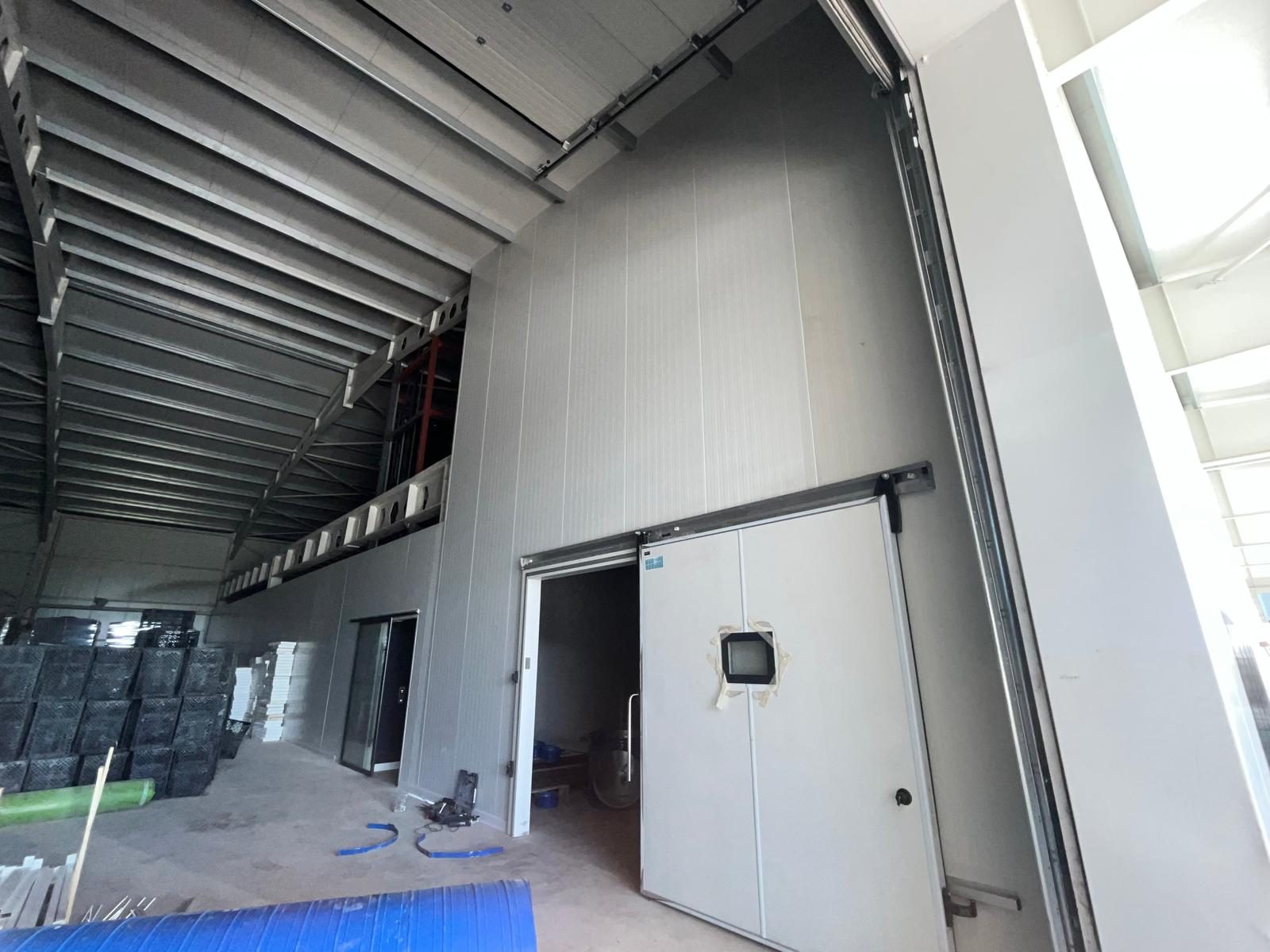 An industrial enclosure lined with panels. The photographs are grouped only by appearance.